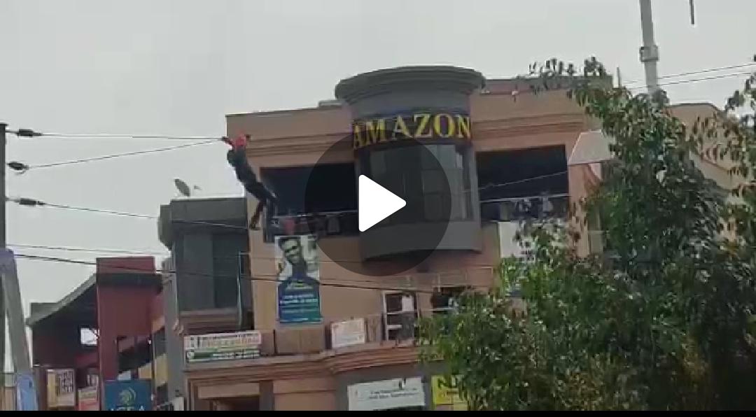VIDEO: Shock! Man in Mbarara climbs on electric wires alongside streets